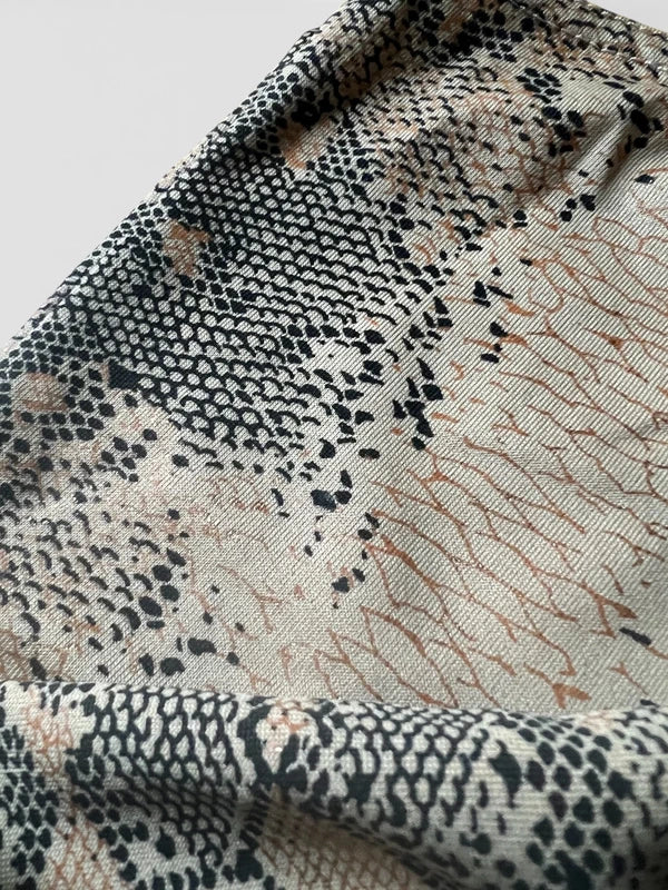 Top monospalla pitonato leggermente shimmer