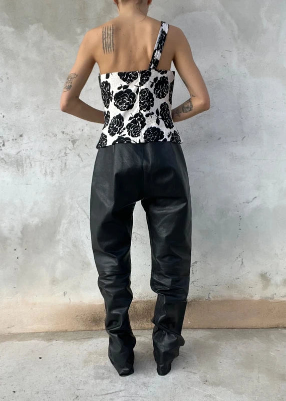 Pantaloni in pelle neri con tasche a filetto
