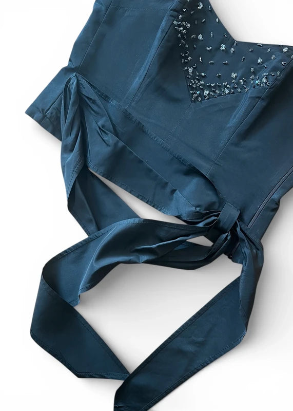 Corpetto nero con fusciacca drappeggiata